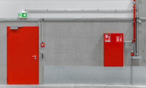 Should fire doors be locked? And can you prop open a fire door?